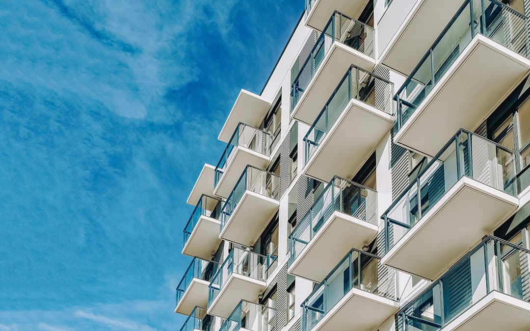 Condo building against a blue sky