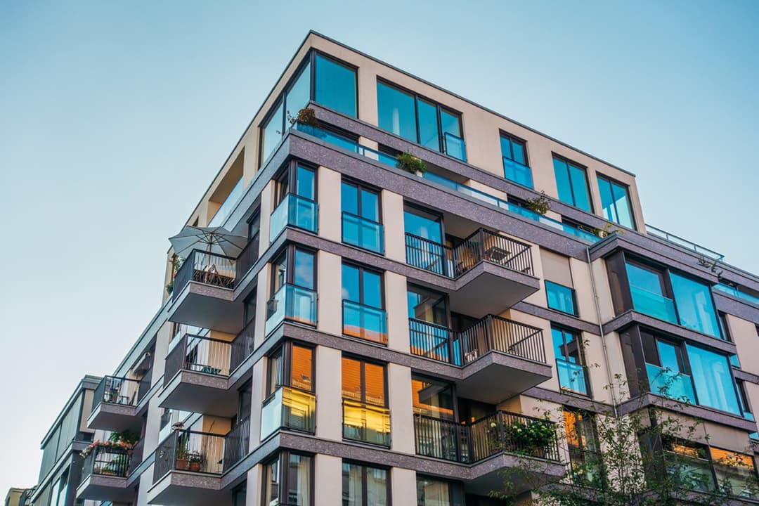 Condo building against a blue sky